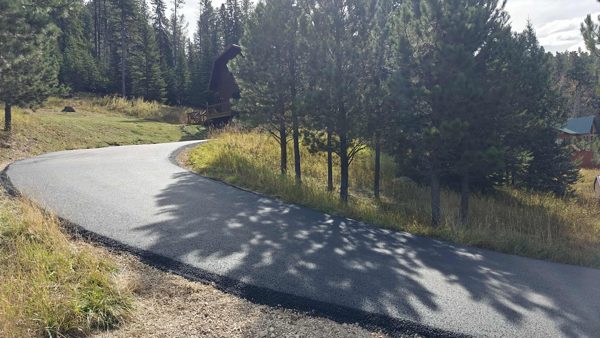 Paved driveway leading to the cabin
