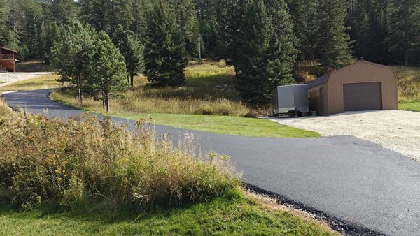 Paved driveway on the property — ideal for motorcycle guests